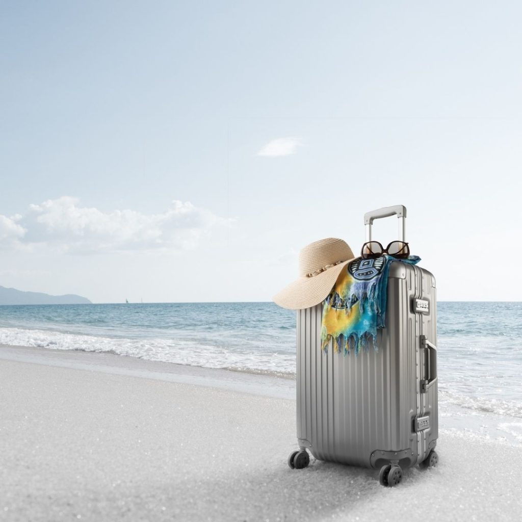 Photo of a suitcase on the beach. 